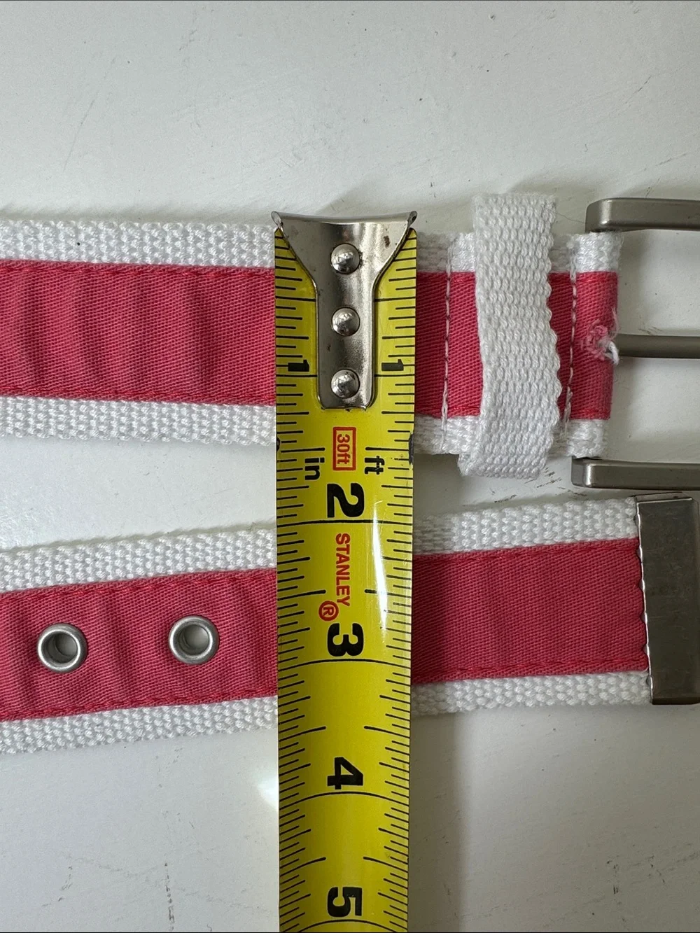 Unbranded coal and white ribboned web belt with silver tone buckle.
